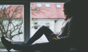 window-view-sitting-indoors-girl