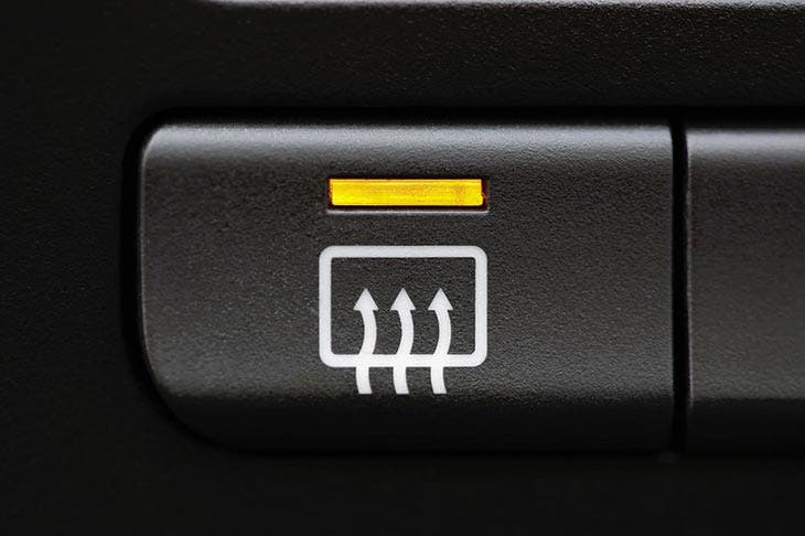 Button to activate to defrost a car 