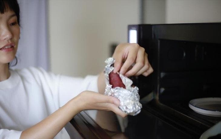 Wrap a potato in aluminum foil to heat it in the microwave