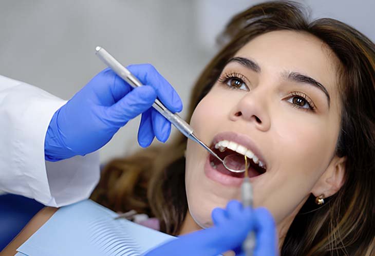 A woman in consultation with a dentist